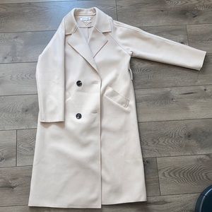 Cream double breasted Modo jacket. It’s about knee length (I’m 5’ 6/7”)